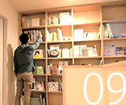 The house with book shelves covering entire walls and a reading space